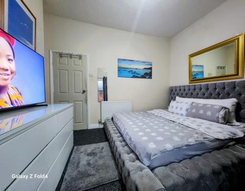 Et tv og/eller underholdning på Luxury King-size Rm