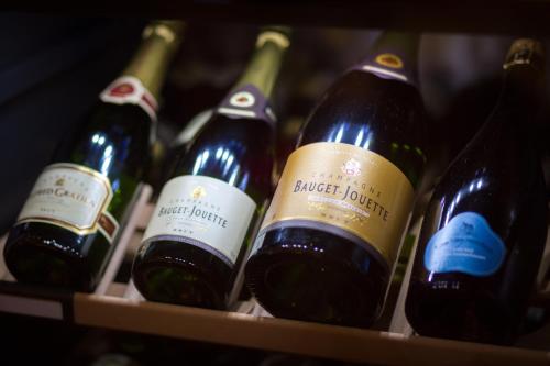 a bunch of bottles of wine on a shelf at Hotel Pilgrimhaus in Soest