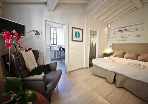 A bed or beds in a room at Apartments Florence Pinzochere Mansarda