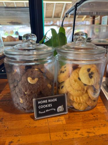 two glass jars filled with cookies on a table at Mama Beach Residence - Adults Only in Phi Phi Don