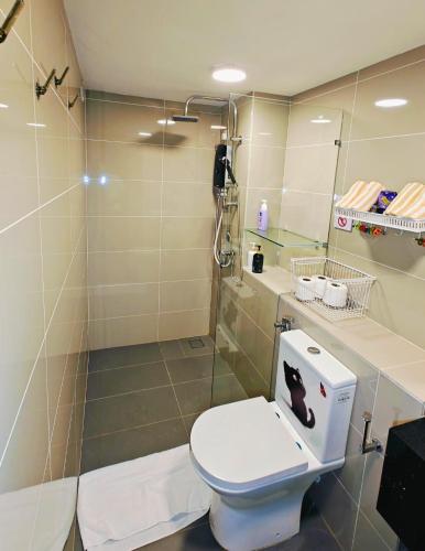 a bathroom with a toilet and a shower at Sunway Grid Loft Suite by Chill Lah Home in Iskandar Puteri