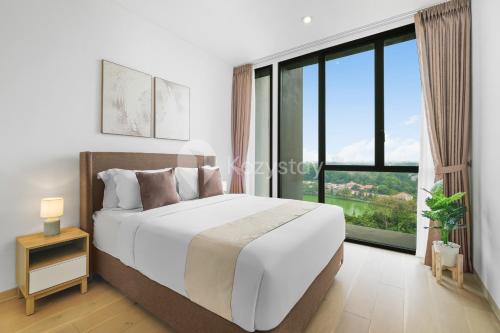 a bedroom with a bed and a large window at Nieve by Kozystay - Cilandak in Jakarta