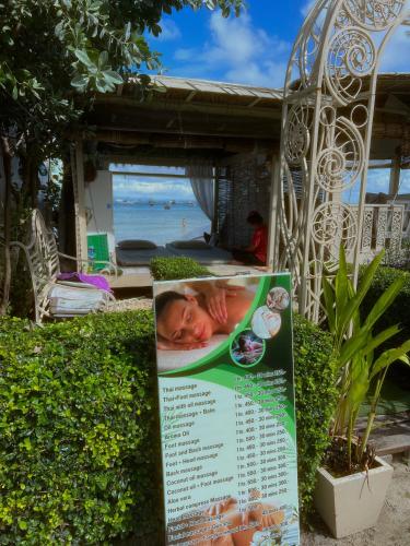 a sign for a baby in a bath tub at Mama Beach Residence - Adults Only in Phi Phi Don
