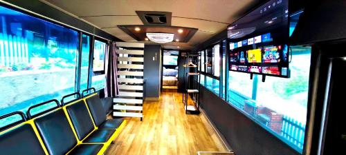 a train car with stairs in a room with windows at Campod Resort @ Cameron Highlands in Cameron Highlands