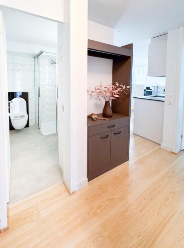 a bathroom with a toilet and a sink at Chalet Ribi in Grindelwald