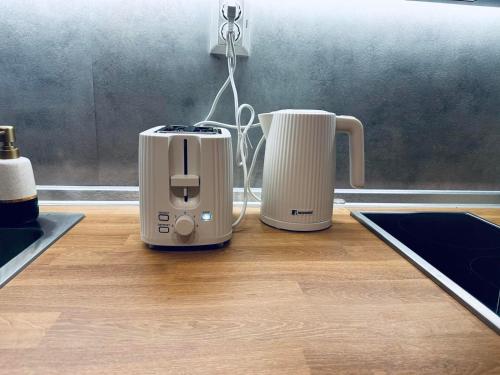 a toaster and a toaster sitting on a kitchen counter at Sky Hills 2 Apartment in Sandanski