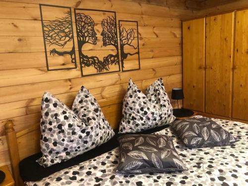 a bedroom with a bed with pillows on it at Zelený ostroff Treehouse in Jiříkov