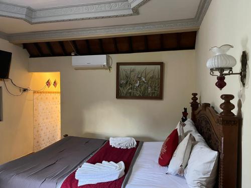 Ένα ή περισσότερα κρεβάτια σε δωμάτιο στο Rodja Balinese House Ubud
