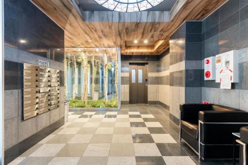 a tasting room with a wine rack in a building at Estrella in Sapporo