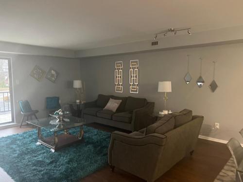 a living room with a couch and a table at Turquoise Gem in Philadelphia