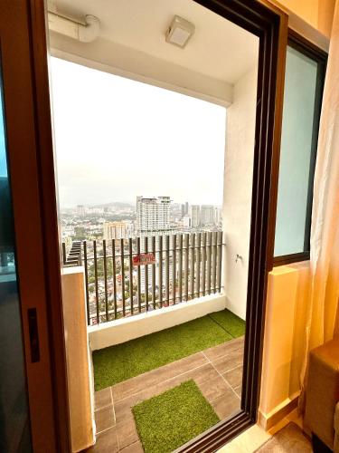 a balcony with a view of a city at The Luxe Colony Klcc By NTR Resources in Kuala Lumpur