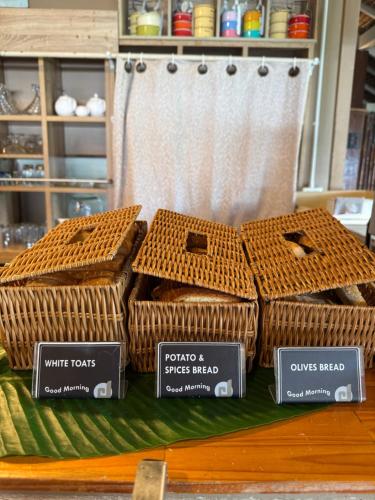 a display of wicker baskets on a table at Mama Beach Residence - Adults Only in Phi Phi Don
