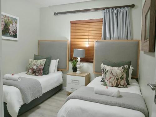 Ένα ή περισσότερα κρεβάτια σε δωμάτιο στο Rosebud 4 Beacon Point