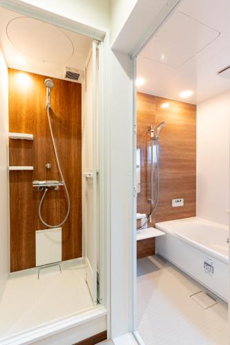 a bathroom with a shower and a sink at Villa Fuji-nishiki in Fujikawaguchiko