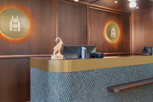 a lobby of a hotel with a reception desk at Waldstätterhof Swiss Quality Hotel in Luzern