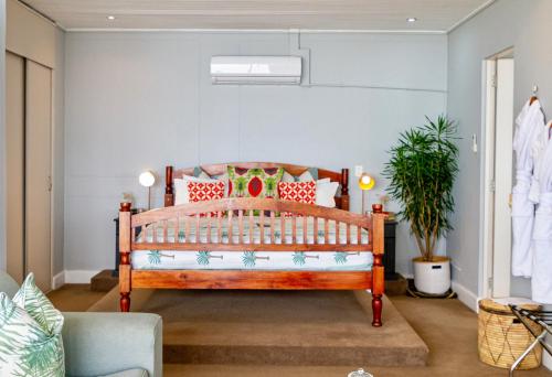a bedroom with a wooden bed in a room at Royal Boutique Hotel in Cape Town