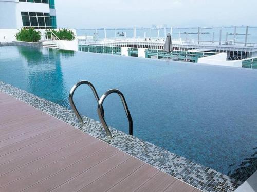a swimming pool on top of a building at Seaview Seafront Duplex in Town with WiFi & Full Kitchen 83A in Georgetown