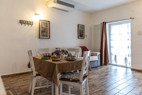a dining room with a table and chairs at Agriturismo Why Farm in Marano Ticino
