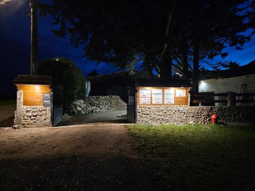 a house with a garage at night at Chambres d'hôtes Provins in Poigny