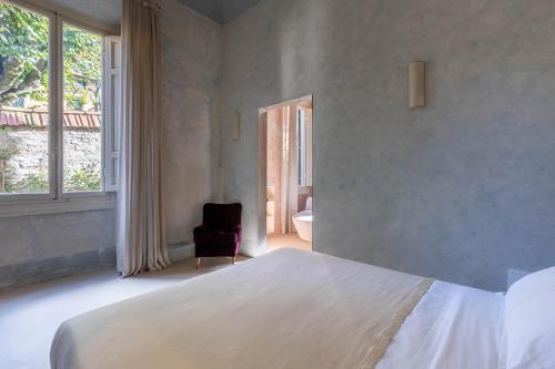Ένα ή περισσότερα κρεβάτια σε δωμάτιο στο Palazzina Maresa