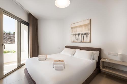 Ένα ή περισσότερα κρεβάτια σε δωμάτιο στο Colinas - Agora 2-3 DELUXE 1B