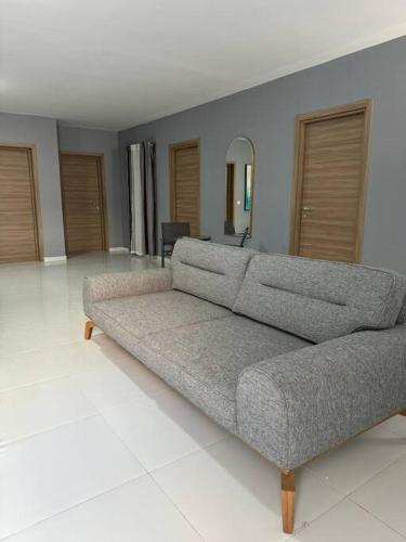 a living room with a couch in the middle at Amadeo Suites in Marsaskala