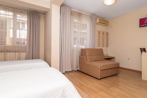 Katil atau katil-katil dalam bilik di Family Hotel Madrid