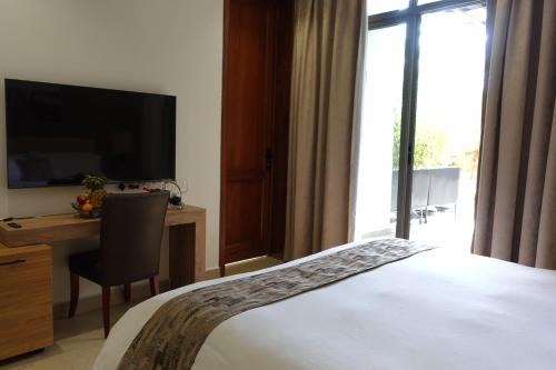 Televisyen dan/atau pusat hiburan di The Hideaway Boutique Hotel