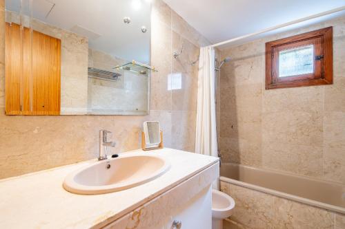 a bathroom with a sink and a toilet at Montemar 34 in Port de Soller