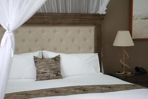 Katil atau katil-katil dalam bilik di The Hideaway Boutique Hotel
