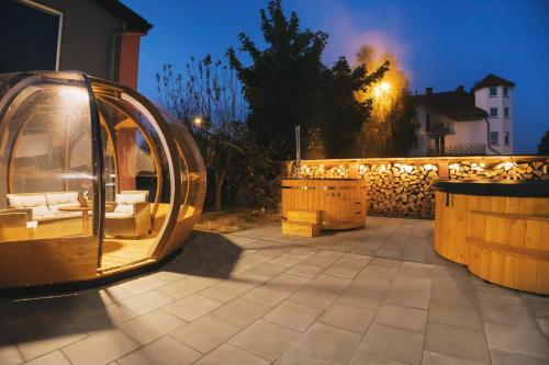 a gazebo on a patio at night at Reda in Mielno