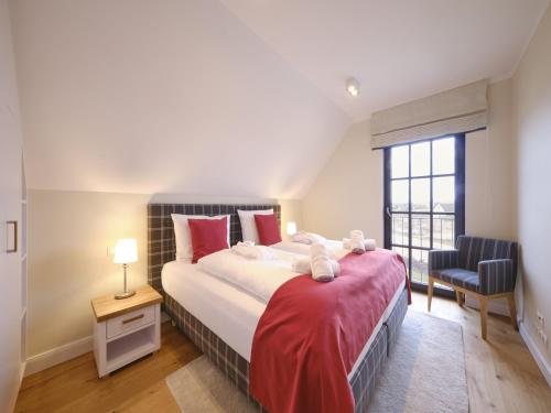 Postel nebo postele na pokoji v ubytování Reetland am Meer - LuxusPlus Reetdachvilla mit 4 Schlafzimmern und Kamin G08