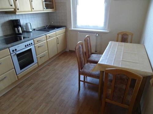 Η κουζίνα ή μικρή κουζίνα στο Ferienwohnung Brinkstr