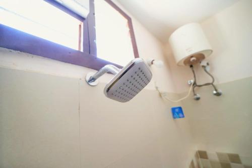 a sink in a bathroom with a window at CM Stays Service Apartment - Near Chennai Airport - Pallavaram in Chennai