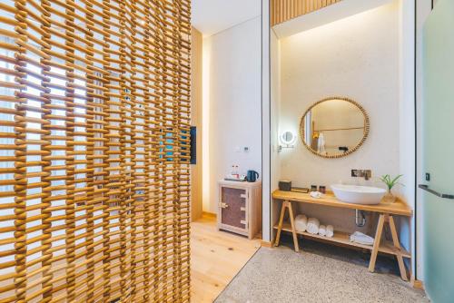 a bathroom with a sink and a mirror at Manli Hotel Shanghai Pudong Airport Branch -Provide free shuttle buses to Pudong Airport and Disneyland in Shanghai