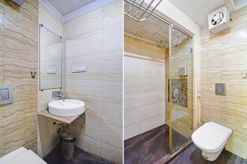 a bathroom with a shower and a toilet and a sink at Super Collection O Avenue Regency Near Kalighat Kali Temple in Kolkata