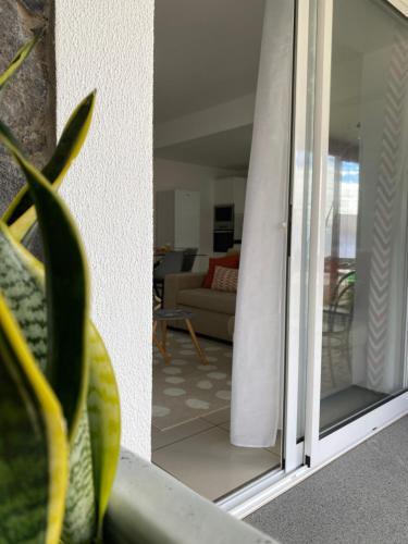 a view of a living room from a sliding glass door at Mine House in Calheta