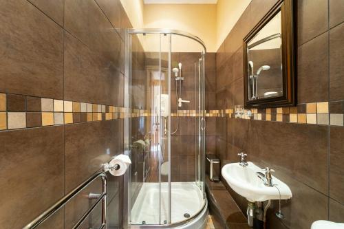 a bathroom with a shower and a sink at Langdale Crag in Grasmere