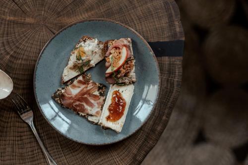 a plate with two slices of food on a table at Haga Slott in Enköping