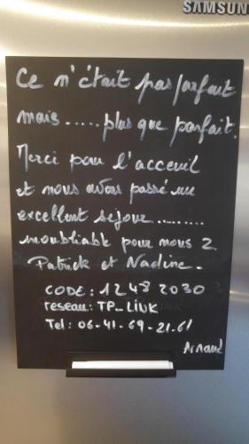 a chalkboard with writing on it on a wall at Gites Spa Strasbourg - Appartement in Furdenheim