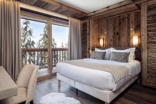 En eller flere senge i et værelse på Antarès URSA 301 - luxury apartment ski inski out