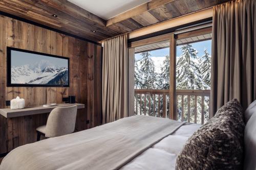 En eller flere senge i et værelse på Antarès URSA 301 - luxury apartment ski inski out