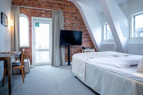 Postel nebo postele na pokoji v ubytování Regatta Spa Hotel