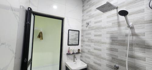 a bathroom with a shower and a toilet and a sink at Homestay Irdina Adryana Free Wifi in Kuala Terengganu