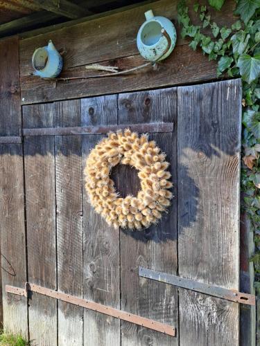 a wooden door with a wreath on it at Drevenica pod Lánom in Zuberec