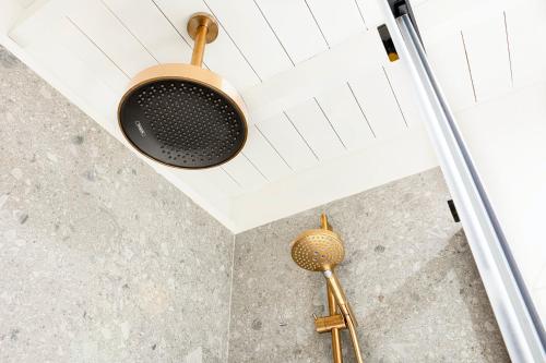 a pot hanging from the ceiling of a bathroom at Superb Chalet Monterosa in Anzino