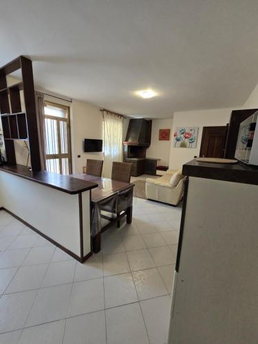 a living room with a couch and a table at Il Gelsomino in Tuscania