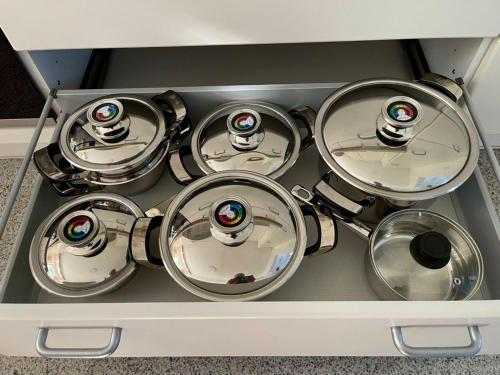 a bunch of pots and pans in a drawer at Villa Aigner in Achenkirch