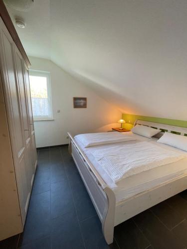 Postel nebo postele na pokoji v ubytování Ferienhaus, Am Süßling 15, Glowe