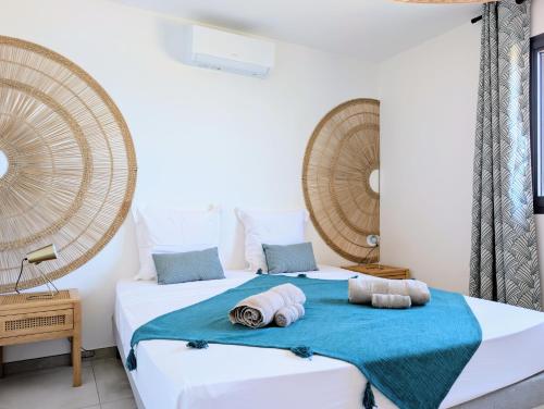 Ένα ή περισσότερα κρεβάτια σε δωμάτιο στο Villa Aurélor - Grande villa 3 chambres à La Saline les Bains